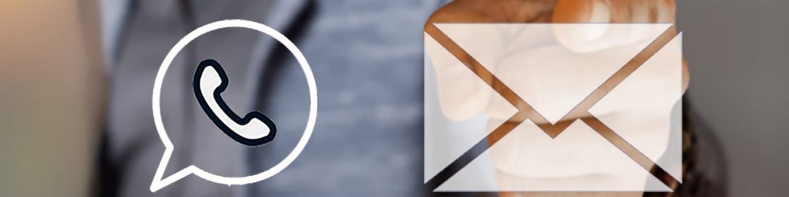 Three service centre workers wearing headsets smiling at a computer screen