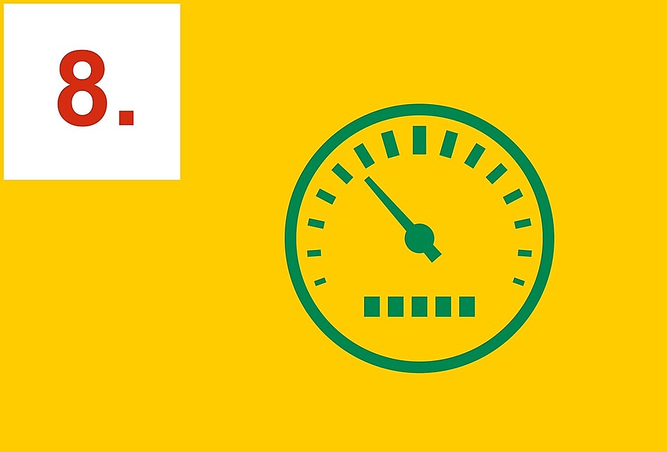 Grön hastighetsmätare på en gul bakgrund